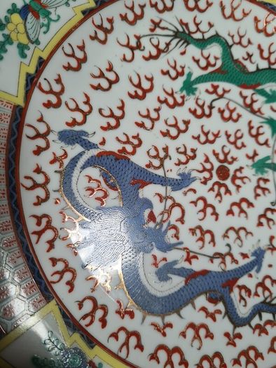 Vintage chinese porcelain plate with dragons decoration hand painted