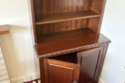 Traditional wooden dresser with shelving and cupboard