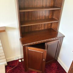 Traditional wooden dresser with shelving and cupboard