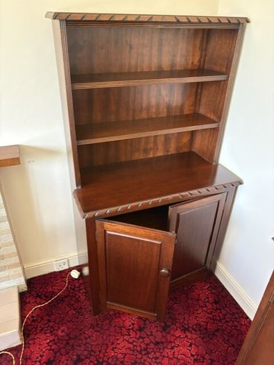 Traditional wooden dresser with shelving and cupboard