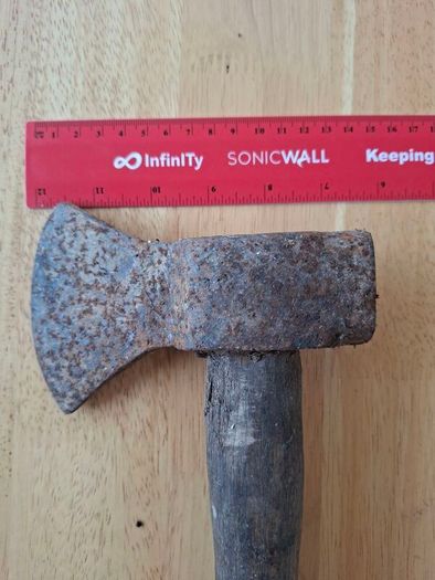 Old hatchet, hand axe.