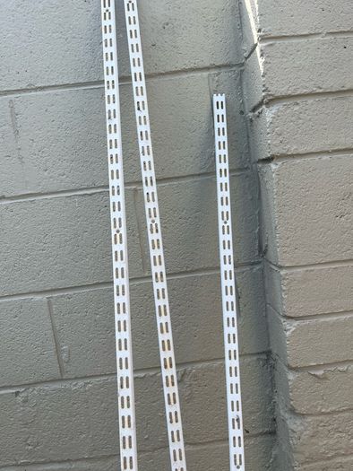 Adjustable shelving rails and brackets