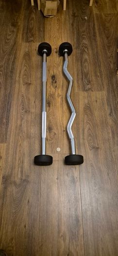 two brand new 10 kilo fixed barbells