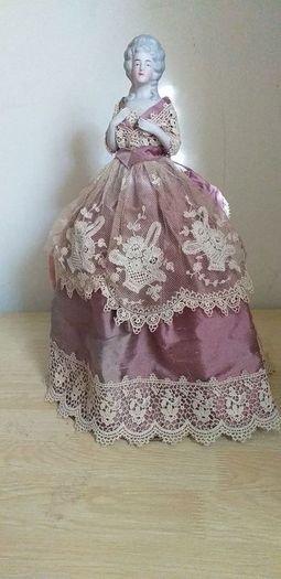 antique half pin doll with skirt