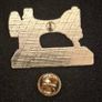 Sewing machine, pin back badge. Image 2