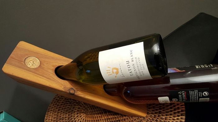 Floating wine bottle holder