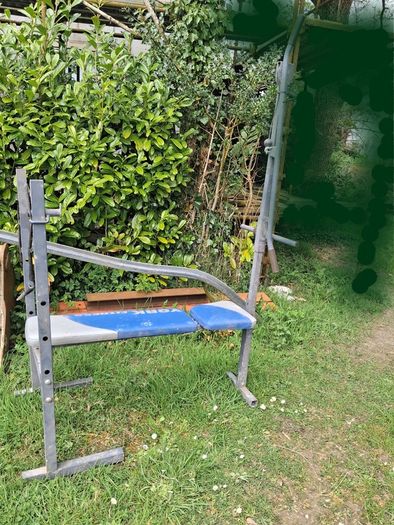 Stroller/tonka truck/ironing board/weight bench.