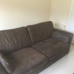 Two distressed leather sofas and a fabric sofa bed