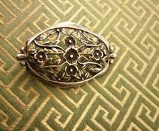 Silver brooch lovely cut out floral design