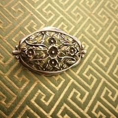 Silver brooch lovely cut out floral design