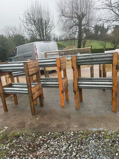 Raised beds bird feeders and cast iron benches