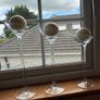 Set of 3 clear glass stemmed candle holders with ivory candles Image 5
