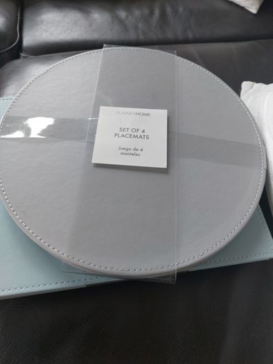Sets of 4 circular placemats. Grey / duck egg.