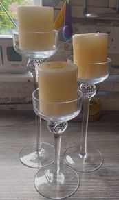 3 glass candle holders with candles