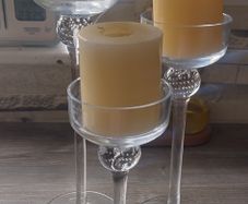 3 glass candle holders with candles