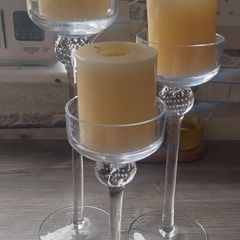 3 glass candle holders with candles
