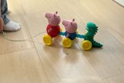 TOMY Toomies Pull Along Peppa - Wibble Wobble Action Peppa Pig, George &amp; Dinosaur Toy - Wheeled Walking &amp; Crawling Toddler Toys