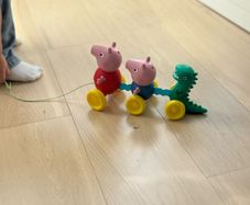 TOMY Toomies Pull Along Peppa - Wibble Wobble Action Peppa Pig, George & Dinosaur Toy - Wheeled Walking & Crawling Toddler Toys