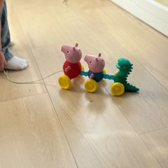 TOMY Toomies Pull Along Peppa - Wibble Wobble Action Peppa Pig, George & Dinosaur Toy - Wheeled Walking & Crawling Toddler Toys