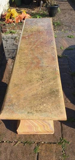 Sandstone garden table and two benches.