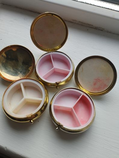 Three vintage pill boxes.
