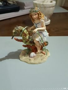 Fairy riding a seahorse