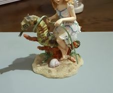 Fairy riding a seahorse