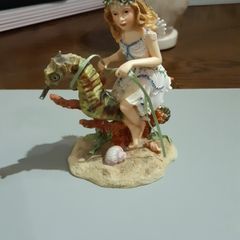 Fairy riding a seahorse