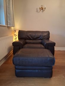 Leather armchair with matching footstool