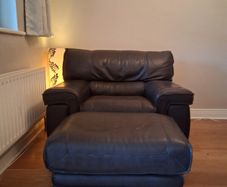 Leather armchair with matching footstool