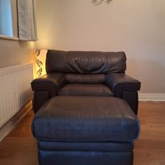 Leather armchair with matching footstool