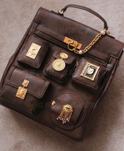 Vintage inspired dark brown backpack with antique gold details