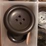 Box of assorted Brown/ grey buttons. Image 5