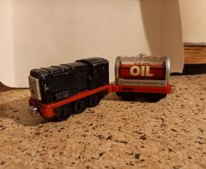 Vintatage steel Thomas  train and carriages. Magnet hook up