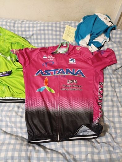 2 cycling shirts 1 is cube worth easily 50 euro and is brand new and pants with padding for on the saddle brand new never worn the second shirt is the official astana team training shirt also brand new  is the  would like to sell all together for a good p