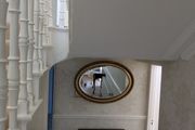 Ornate oval mirror