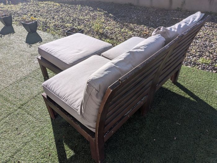 Wooden outdoor lounger with cushions