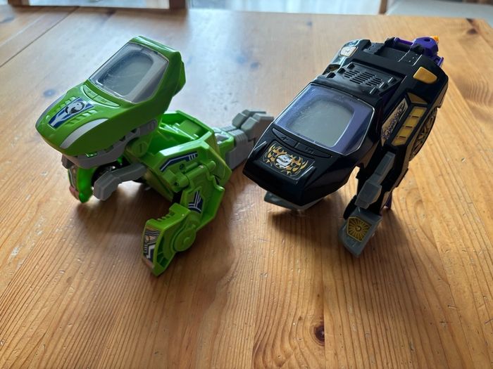Two V-Tech Switch & Go Dinos