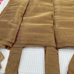 A Pair of Tab Top Voile Curtains. ( Gold) 110 x 230 cm New.