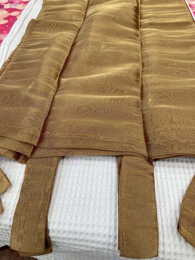 A Pair of Tab Top Voile Curtains. ( Gold) 110 x 230 cm New.