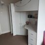 high bed for sale with 3 drawers, 3 small shelves, a small wardrobe and a deak underneath. Mattress included. Height 172cm, Width 192cm, Depth 95cm. Some small marks on desk and back of desk - see photos Image 2