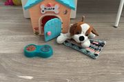 Cute stuffed dog and dog house