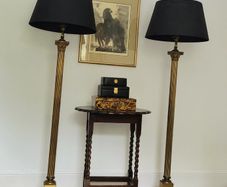 Mid-century pair of brass corinthian column standard lamps