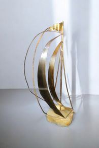 Brass sailing boat on crystal stand