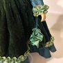 Vintage porcelain doll in green velvet dress Image 4