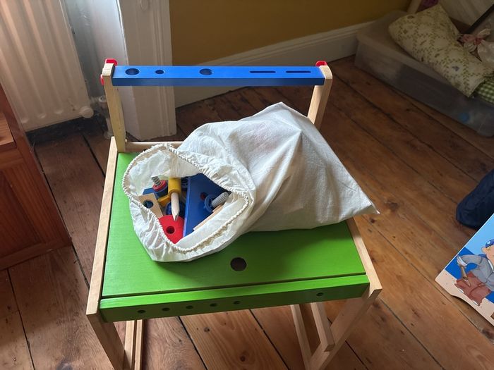 Workbench/desk with bag of tools and accessories