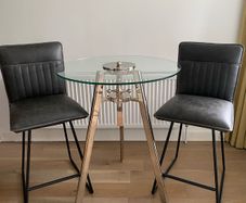 Metal and Glass Crank Table + Cooper Swivel Counter Stools