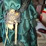 Vintage Large Victorian-style collectible Porcelain Doll featuring curly reddish-brown hair and a multi-layered emerald green satin and lace dress Image 4