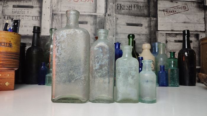 266 - Set of 4 Vintage Universal Medicine Chemicals Clear Glass Decorative Collectible Bottles