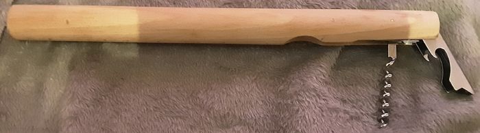 unusual bottle opener, approx a foot long